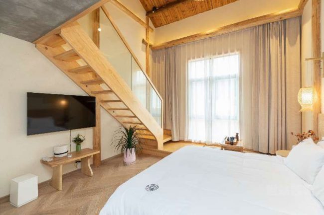 新中式度假酒店复式套房装修图