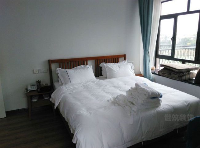 中式简约风民宿客房装修图